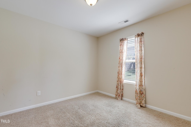 empty room with carpet flooring