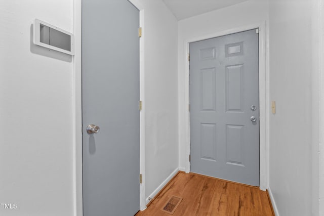 doorway to outside featuring light wood-type flooring