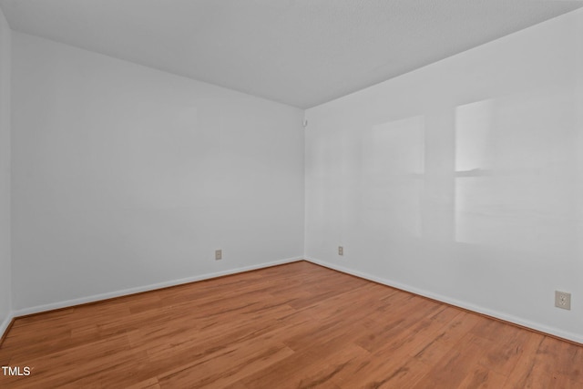 unfurnished room featuring light wood-type flooring