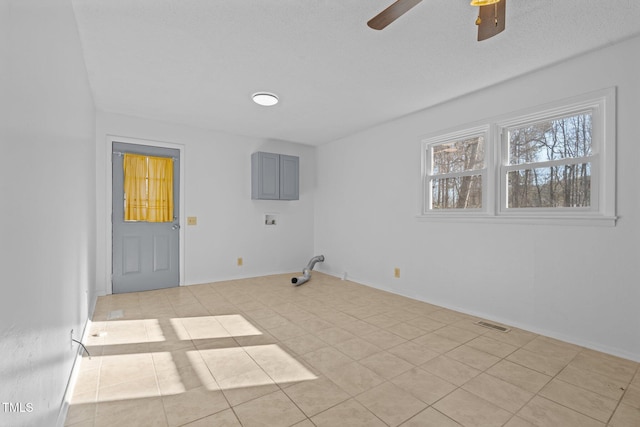 washroom with hookup for a washing machine, light tile patterned floors, and ceiling fan