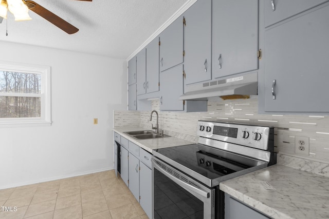 kitchen featuring stainless steel electric range oven, sink, a textured ceiling, gray cabinets, and light tile patterned floors