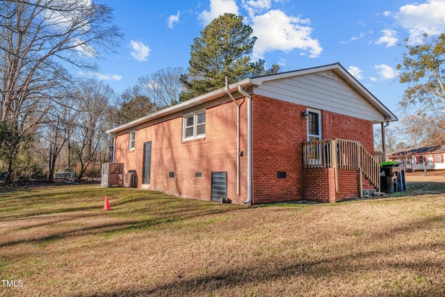 back of property featuring a lawn