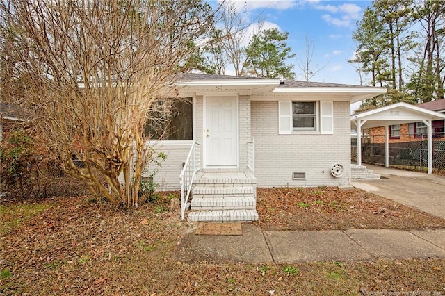 bungalow featuring a carport