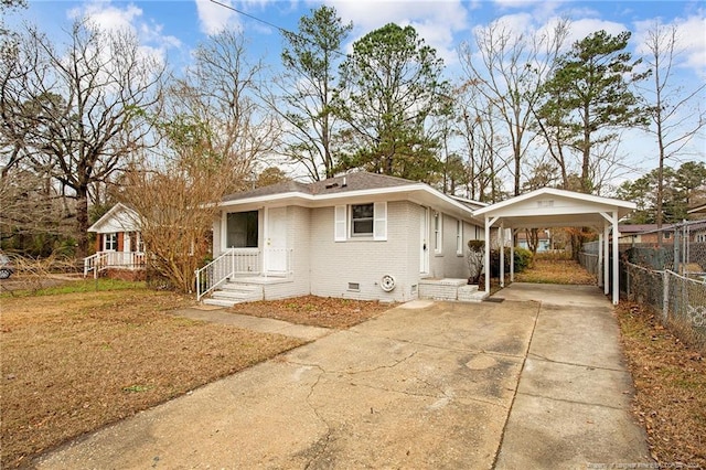 ranch-style home with a carport