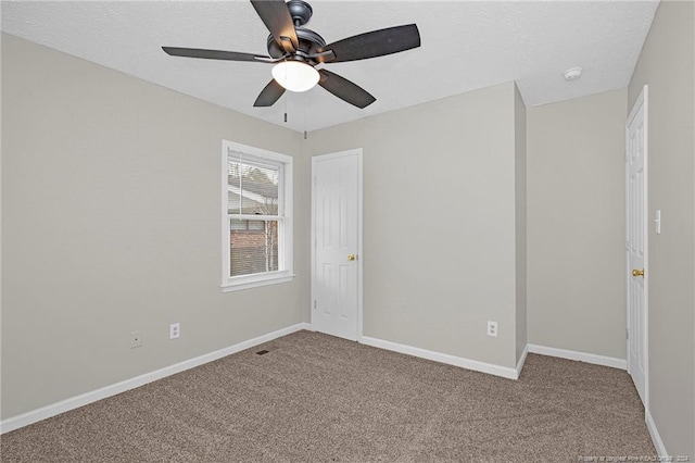 unfurnished bedroom featuring carpet and ceiling fan