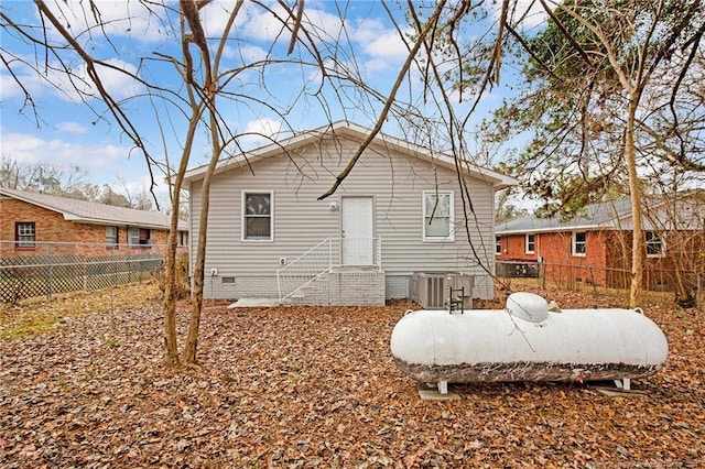 rear view of property featuring central air condition unit