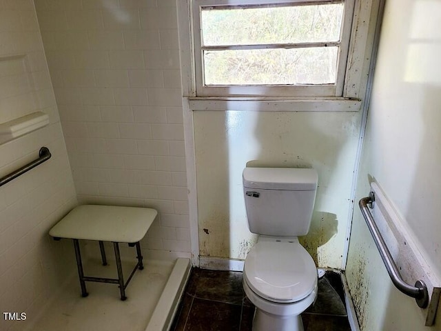 bathroom featuring tile patterned flooring and toilet