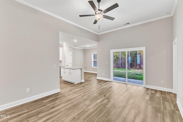 unfurnished living room with light hardwood / wood-style floors, ceiling fan, and ornamental molding