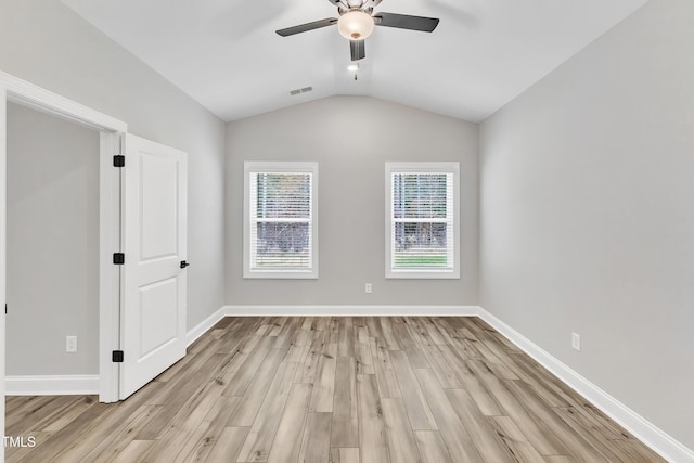 unfurnished room featuring ceiling fan, light hardwood / wood-style floors, and vaulted ceiling