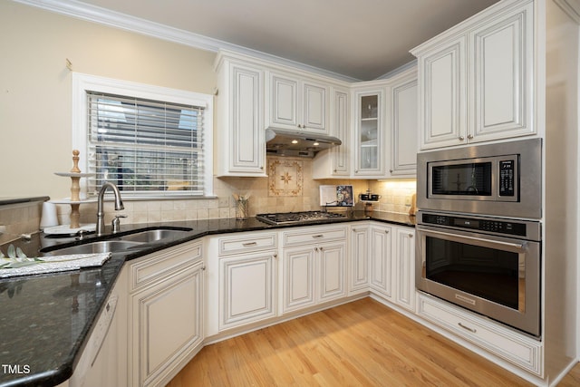 kitchen featuring white cabinetry, sink, and stainless steel appliances