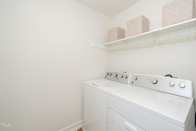 washroom featuring washer and dryer