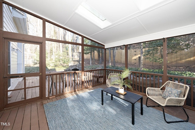 sunroom / solarium with lofted ceiling with skylight