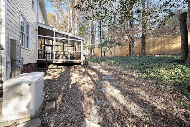 view of yard featuring a sunroom