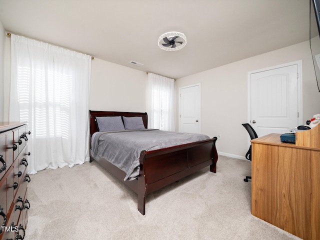 bedroom with light colored carpet