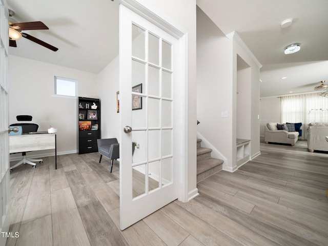 home office with ceiling fan and light wood-type flooring