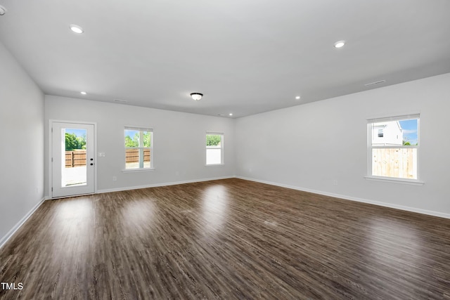 unfurnished room featuring dark hardwood / wood-style flooring