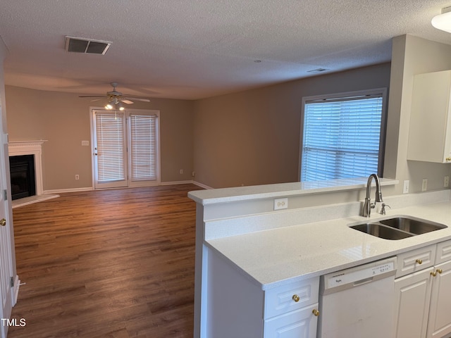 kitchen featuring white dishwasher, sink, ceiling fan, dark hardwood / wood-style flooring, and white cabinetry