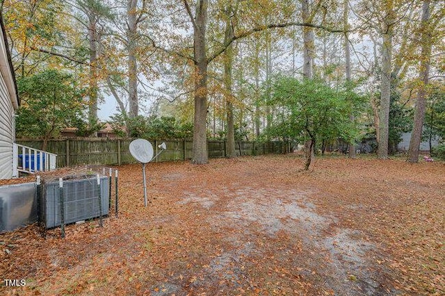 view of yard with central AC unit