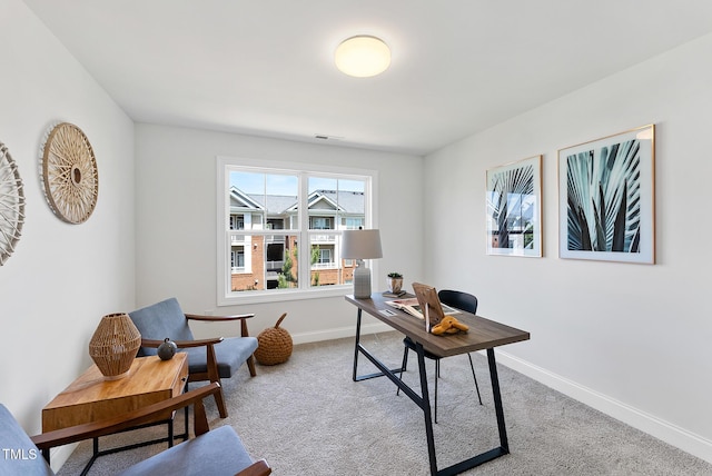 office area featuring light carpet