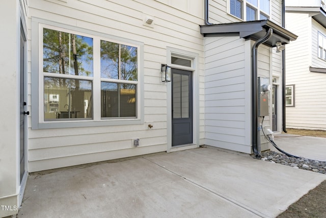 doorway to property featuring a patio