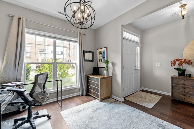 office area with a chandelier and hardwood / wood-style flooring