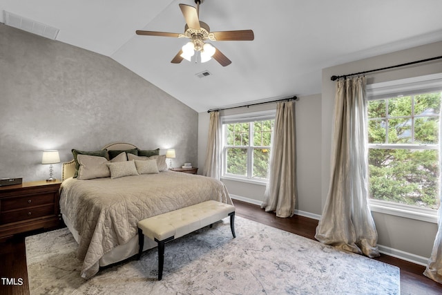 bedroom with ceiling fan, wood-type flooring, and lofted ceiling