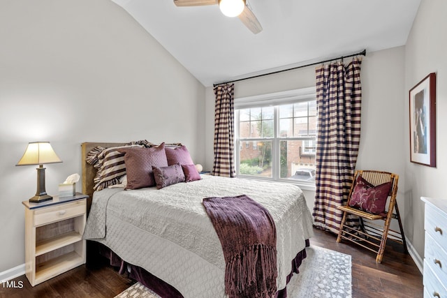 bedroom with vaulted ceiling, ceiling fan, and dark hardwood / wood-style floors