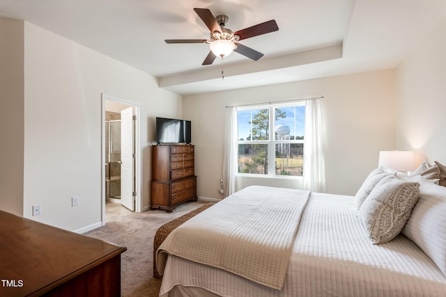 bedroom with connected bathroom, light carpet, and ceiling fan