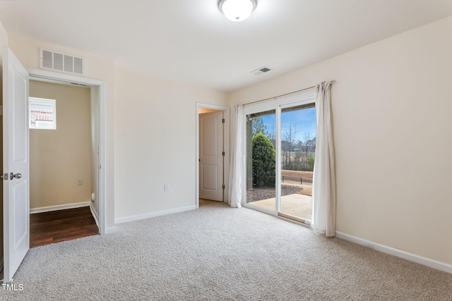 unfurnished room with carpet floors