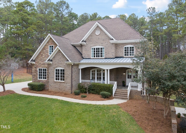 view of front of home featuring a front lawn and a porch