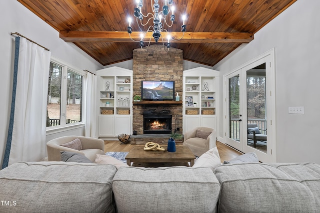 living room featuring a fireplace, a notable chandelier, vaulted ceiling with beams, light wood-type flooring, and wood ceiling