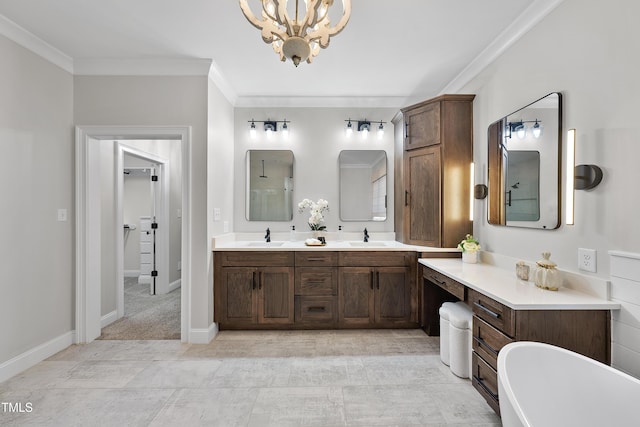 bathroom with a bathtub, vanity, ornamental molding, and an inviting chandelier