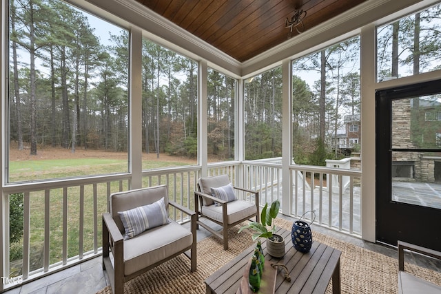 sunroom / solarium featuring wooden ceiling