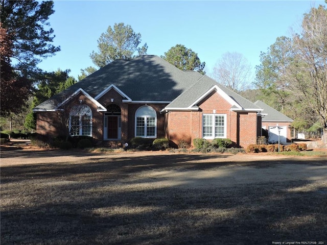 single story home featuring a garage