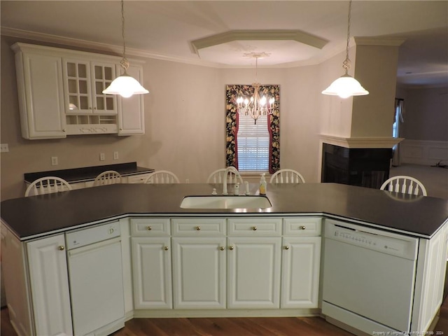 kitchen with white cabinets, dishwasher, sink, and hanging light fixtures