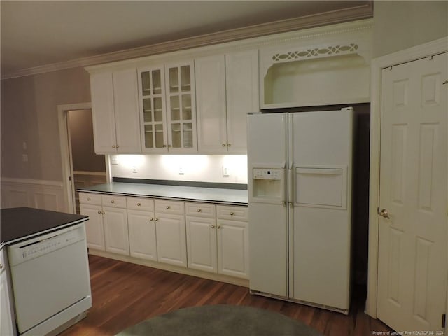 kitchen with white appliances, dark hardwood / wood-style floors, white cabinetry, and ornamental molding