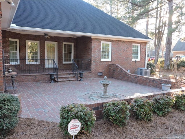 rear view of property with a porch and central air condition unit