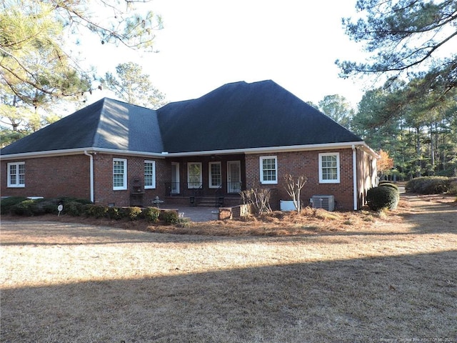 view of front of property with a porch and cooling unit