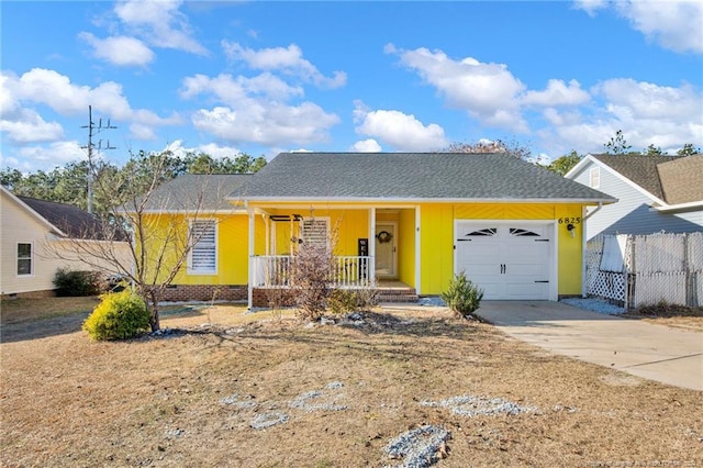 ranch-style house featuring covered porch and a garage