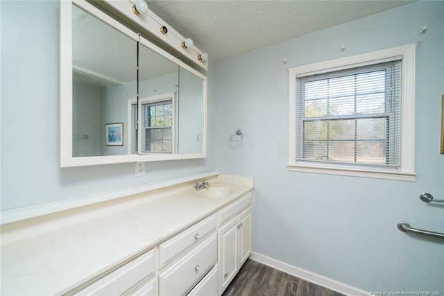 bathroom featuring wood-type flooring and vanity