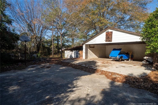 view of home's exterior with a carport