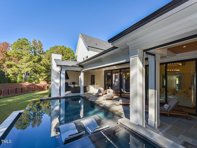 view of swimming pool with a lawn, an outdoor living space, and a patio area