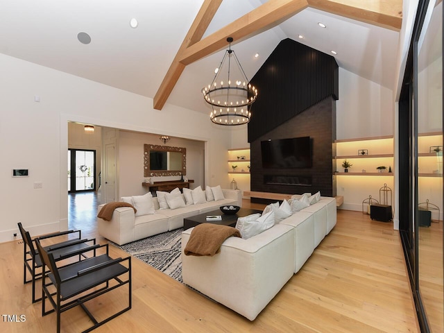 living room with beam ceiling, light hardwood / wood-style flooring, high vaulted ceiling, and a chandelier