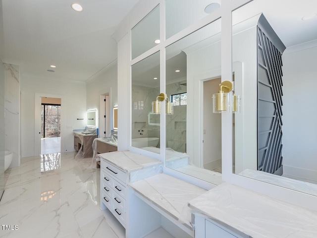 bathroom featuring vanity, a shower with door, and ornamental molding