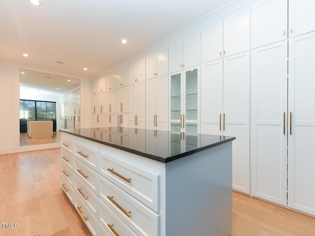 walk in closet with light wood-type flooring