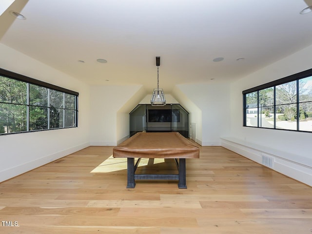 interior space with light hardwood / wood-style floors, a healthy amount of sunlight, and pool table