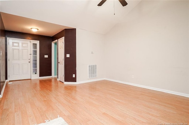 entryway featuring lofted ceiling, light hardwood / wood-style floors, and ceiling fan