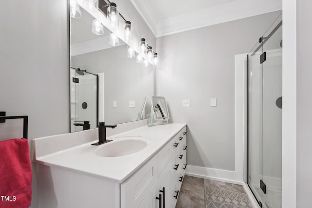 bathroom with crown molding, a shower with door, and vanity