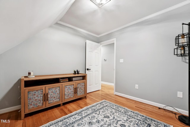 sitting room featuring wood-type flooring and lofted ceiling