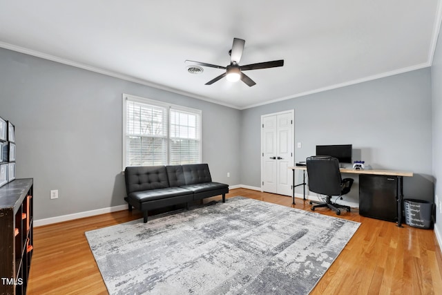 home office featuring hardwood / wood-style flooring, ceiling fan, and crown molding